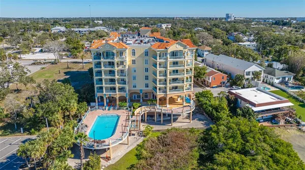 a kitchen with stainless steel appliances granite countertop a refrigerator sink and stove