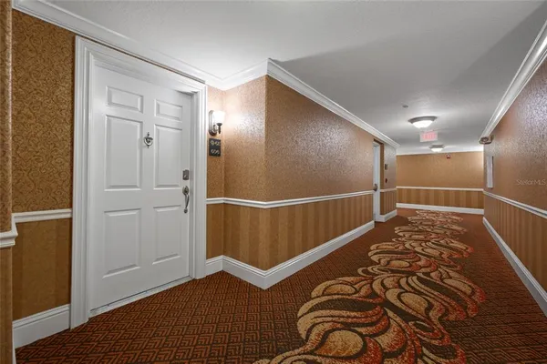 a view of empty room with a fireplace