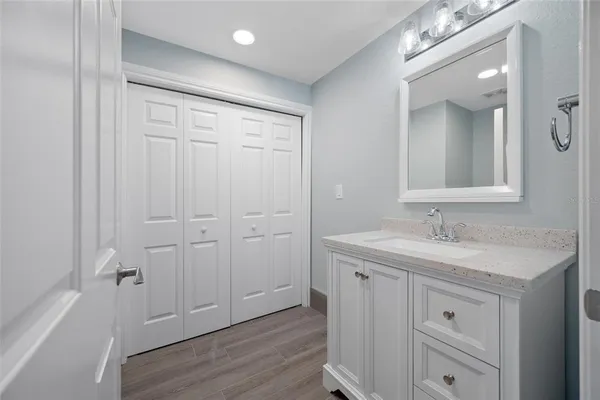 a bathroom with a double vanity sink and mirror
