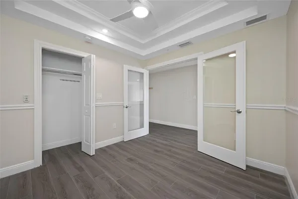 a view of walk in closet with empty racks