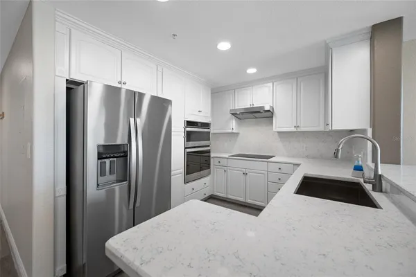 a view of a balcony with wooden floor and fence