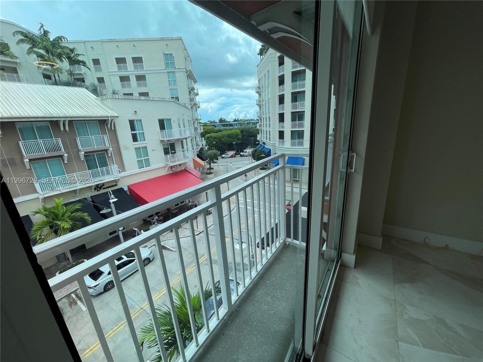 7290 Southwest 90th Street, Unit 307 Miami, FL 33156 - Photo 12 of 14 a view of balcony with furniture