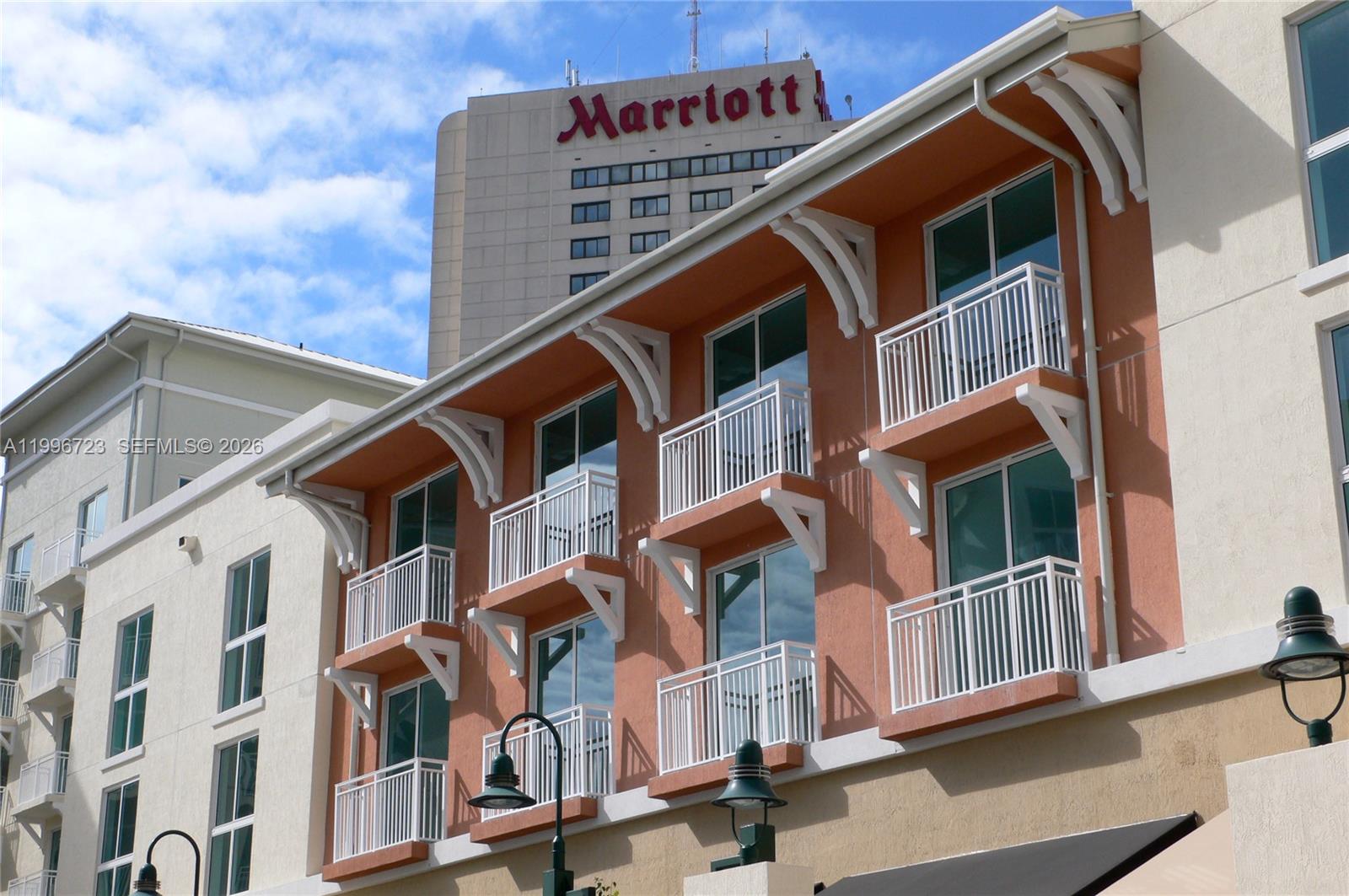 7290 Southwest 90th Street, Unit 307 Miami, FL 33156 - Photo 14 of 14 a front view of a building with many windows