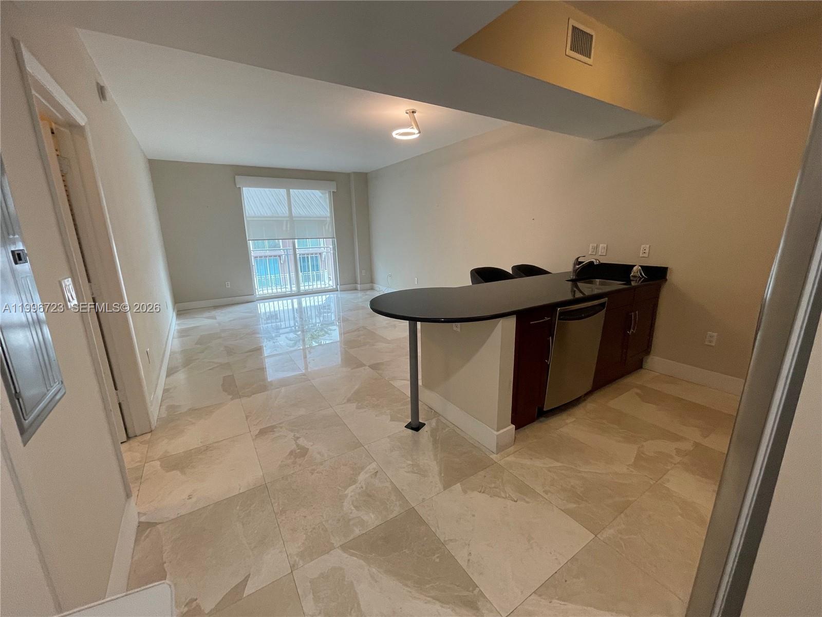 7290 Southwest 90th Street, Unit 307 Miami, FL 33156 - Photo 5 of 14 a living room with furniture