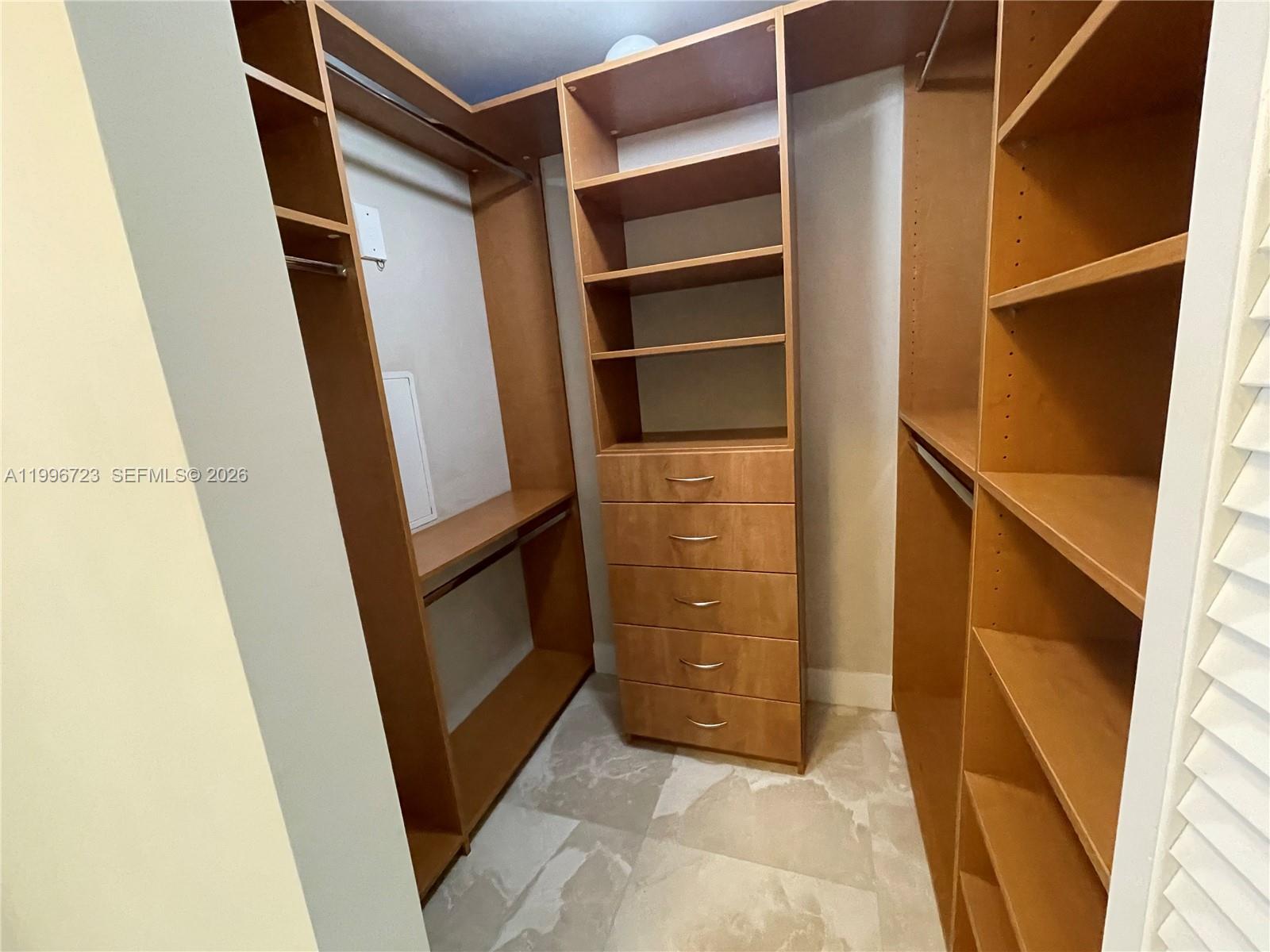 7290 Southwest 90th Street, Unit 307 Miami, FL 33156 - Photo 10 of 14 a view of walk in closet