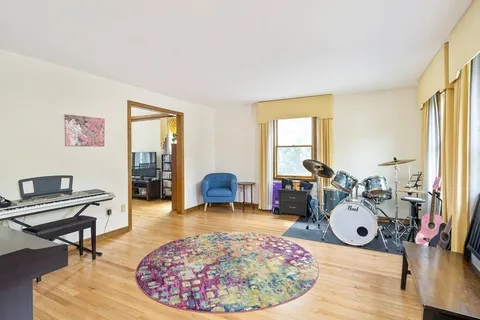 a room with furniture and a wooden floor