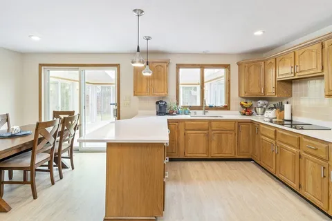 a kitchen with a sink a counter top space and appliances