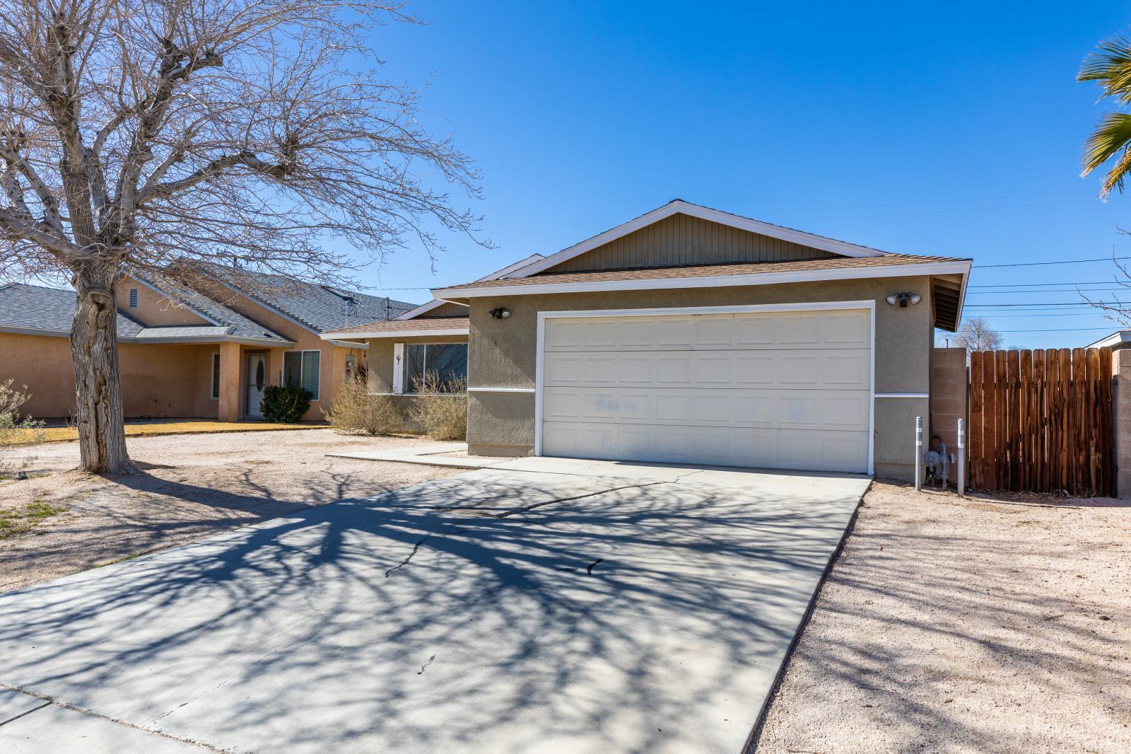 1425 Mayo Street Ridgecrest, CA 93555 - Photo 4 of 28 a front view of a house with a yard