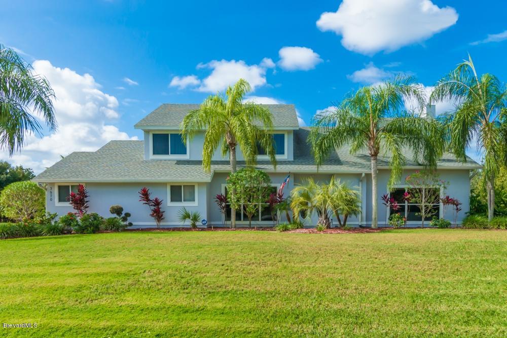 3570 Big Pine Road Melbourne, FL 32934 - Photo 2 of 27 a front view of house with yard