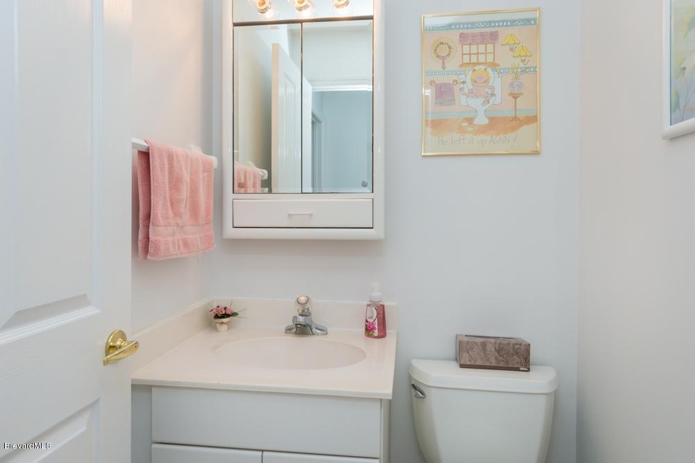 3570 Big Pine Road Melbourne, FL 32934 - Photo 20 of 27 a bathroom with a sink and a toilet