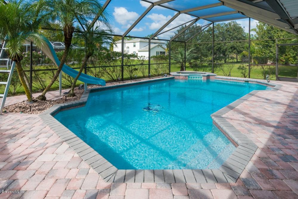 3570 Big Pine Road Melbourne, FL 32934 - Photo 23 of 27 a view of a swimming pool with a patio