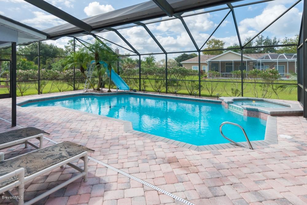 3570 Big Pine Road Melbourne, FL 32934 - Photo 24 of 27 a view of swimming pool with a patio