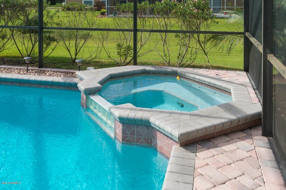 3570 Big Pine Road Melbourne, FL 32934 - Photo 26 of 27 a view of a balcony with floor to ceiling windows and trees