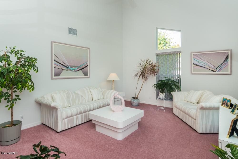 3570 Big Pine Road Melbourne, FL 32934 - Photo 8 of 27 a living room with furniture and a potted plant