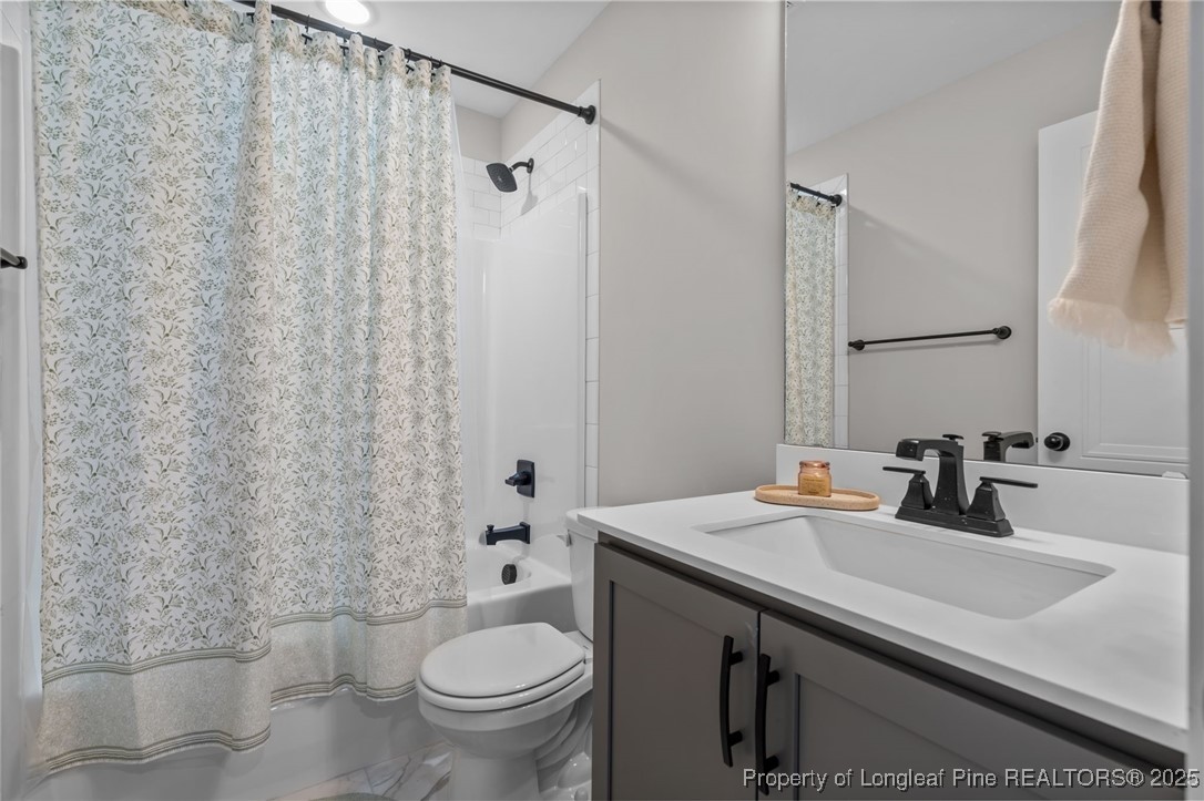 247 North Horace Walters Road Raeford, NC 28376 - Photo 26 of 35 a bathroom with a sink toilet and shower