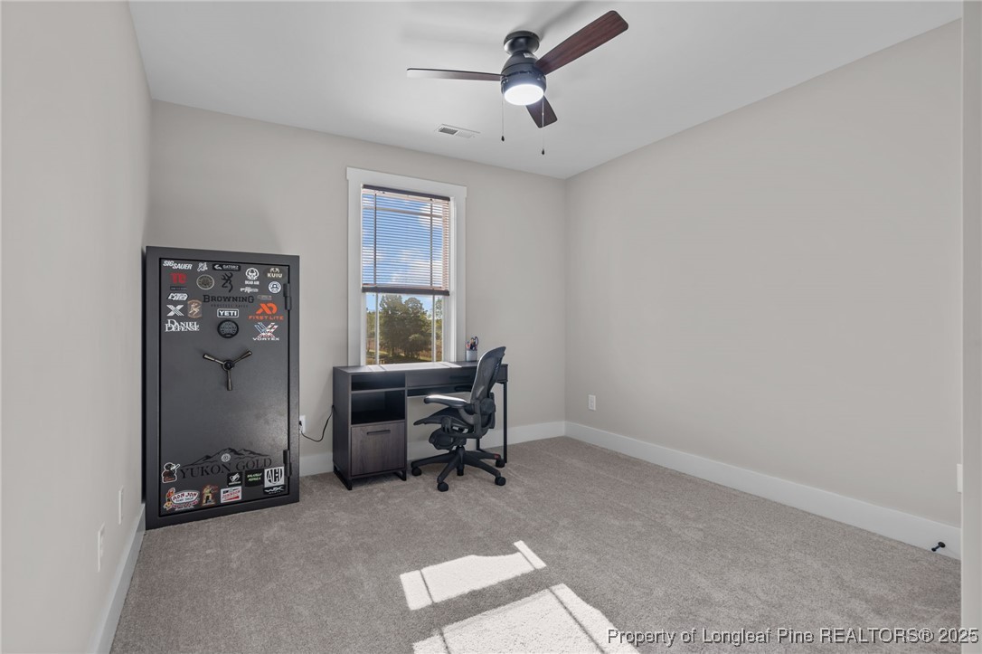 247 North Horace Walters Road Raeford, NC 28376 - Photo 27 of 35 a view of a workspace with furniture and a window