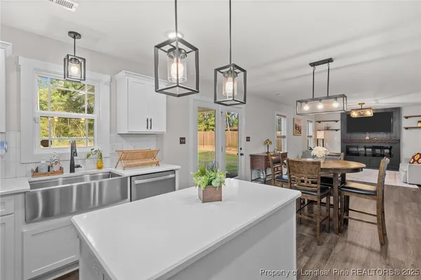 a large kitchen with a table and chairs