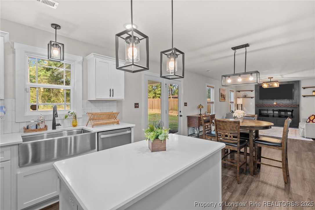 247 North Horace Walters Road Raeford, NC 28376 - Photo 7 of 35 a large kitchen with a table and chairs