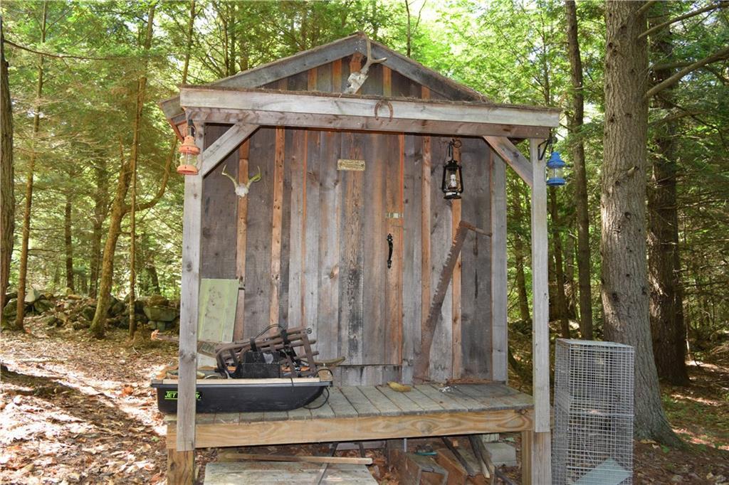 643 Dead River Road Bowdoin, ME 04287 - Photo 31 of 32 Kids playhouse with power in the woods.
