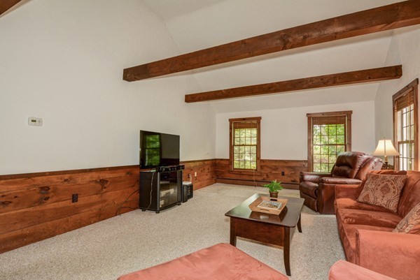 19 Robert Road Stow, MA 01775 - Photo 5 of 30 a living room with furniture and a flat screen tv