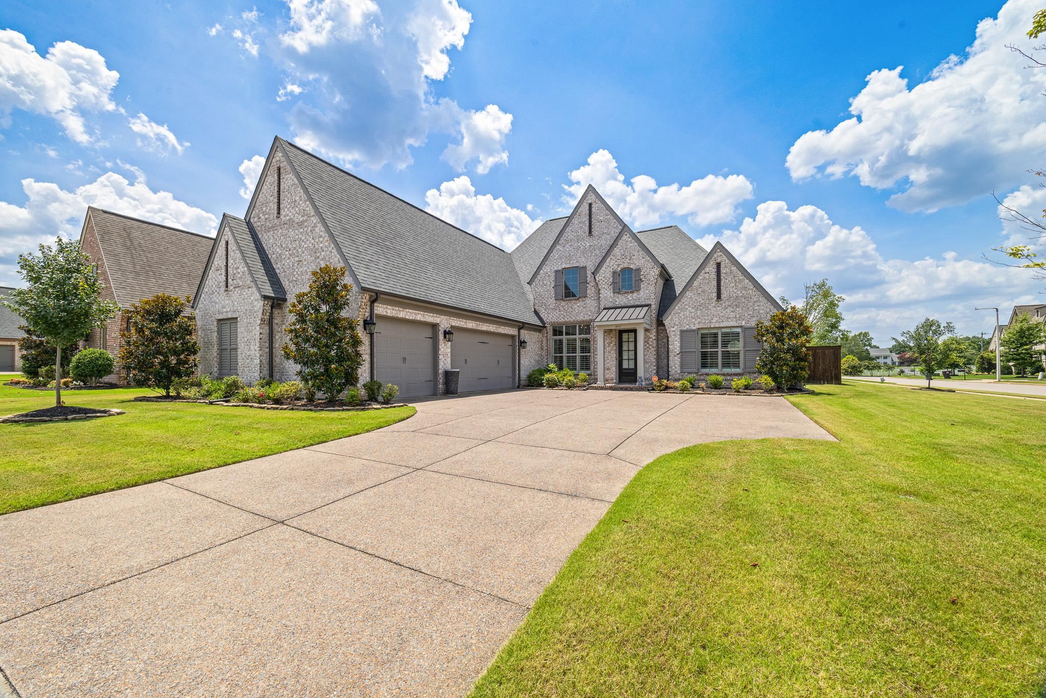 4711 Carousel Lane Collierville, TN 38017 - Photo 1 of 33 a front view of a house with a yard