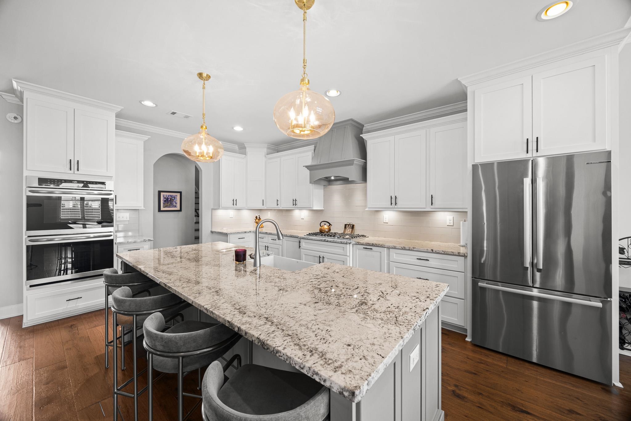4711 Carousel Lane Collierville, TN 38017 - Photo 11 of 33 a kitchen with kitchen island a counter space appliances and cabinets