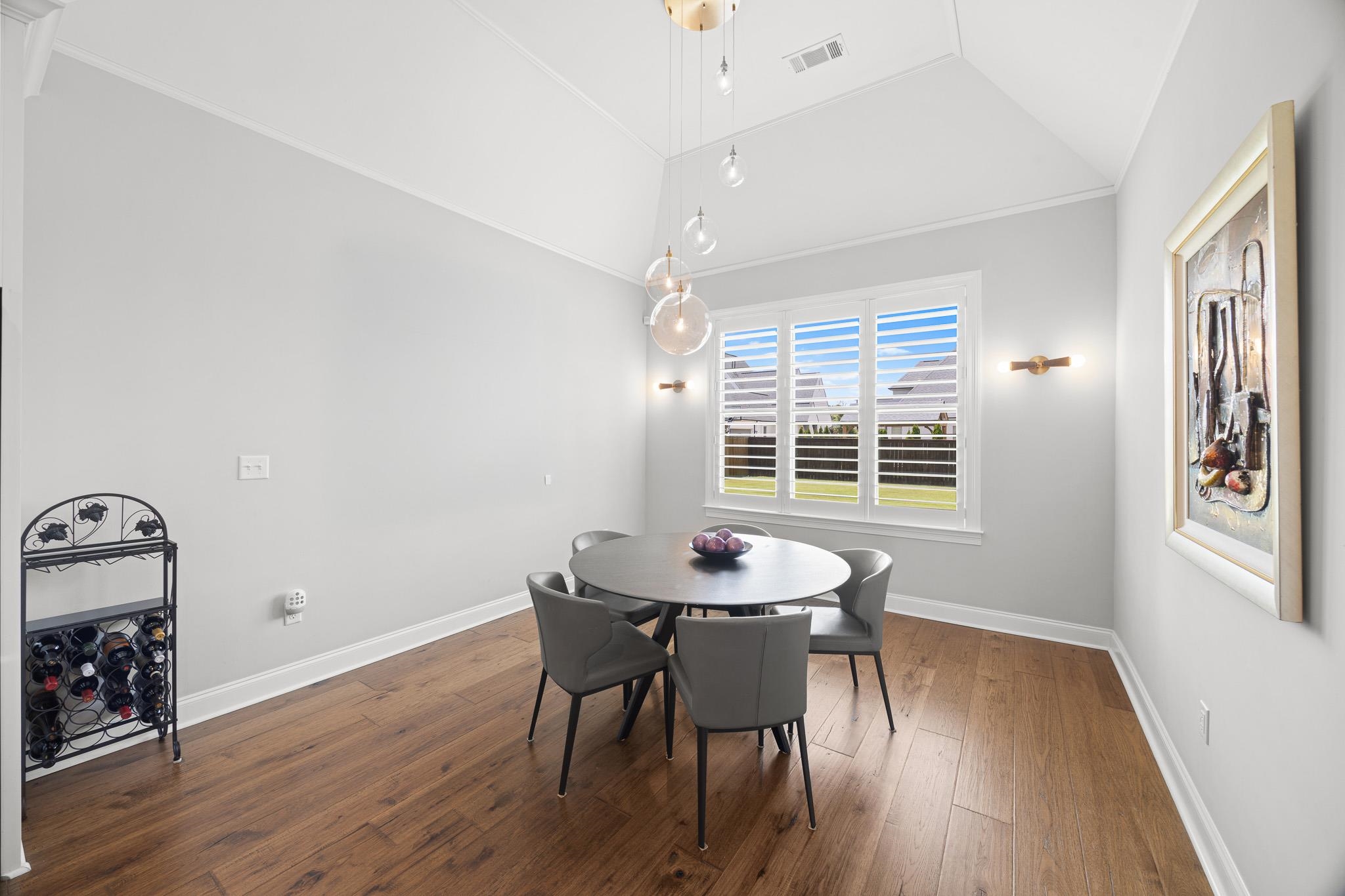 4711 Carousel Lane Collierville, TN 38017 - Photo 12 of 33 a view of a dining room with furniture and wooden floor
