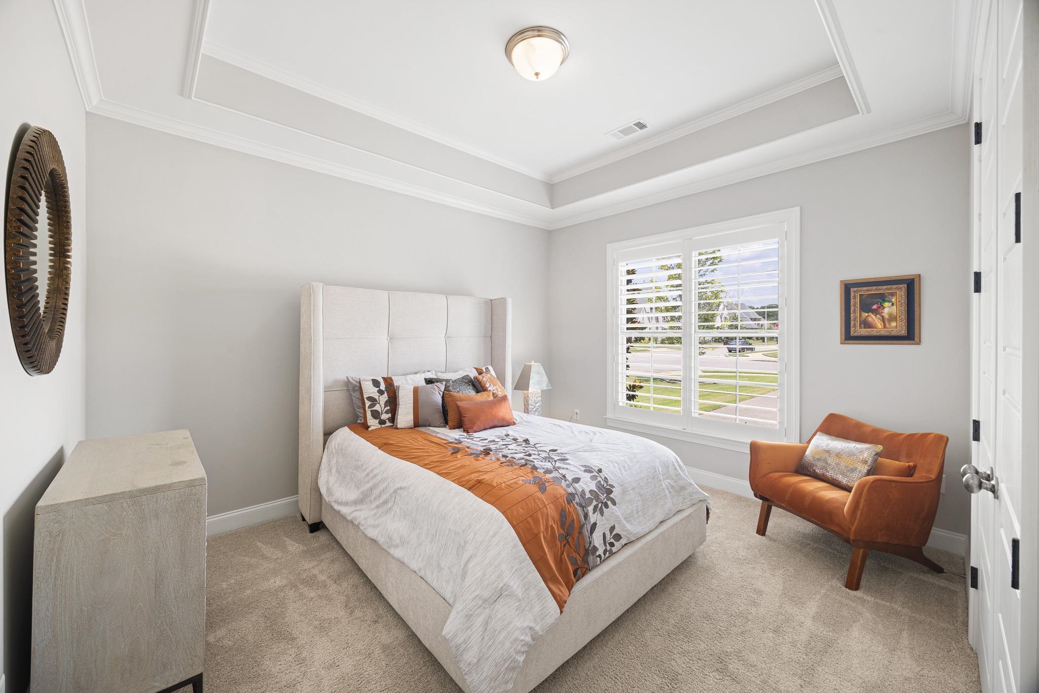 4711 Carousel Lane Collierville, TN 38017 - Photo 16 of 33 a bedroom with bed and a couch