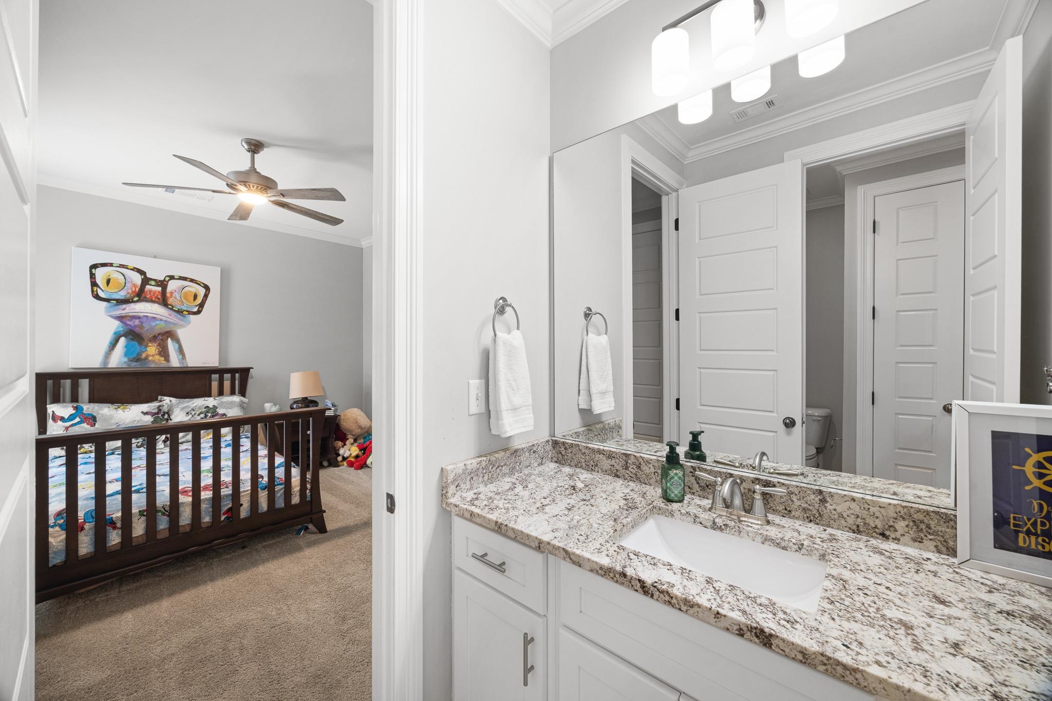 4711 Carousel Lane Collierville, TN 38017 - Photo 20 of 33 a bathroom with a granite countertop sink and a mirror