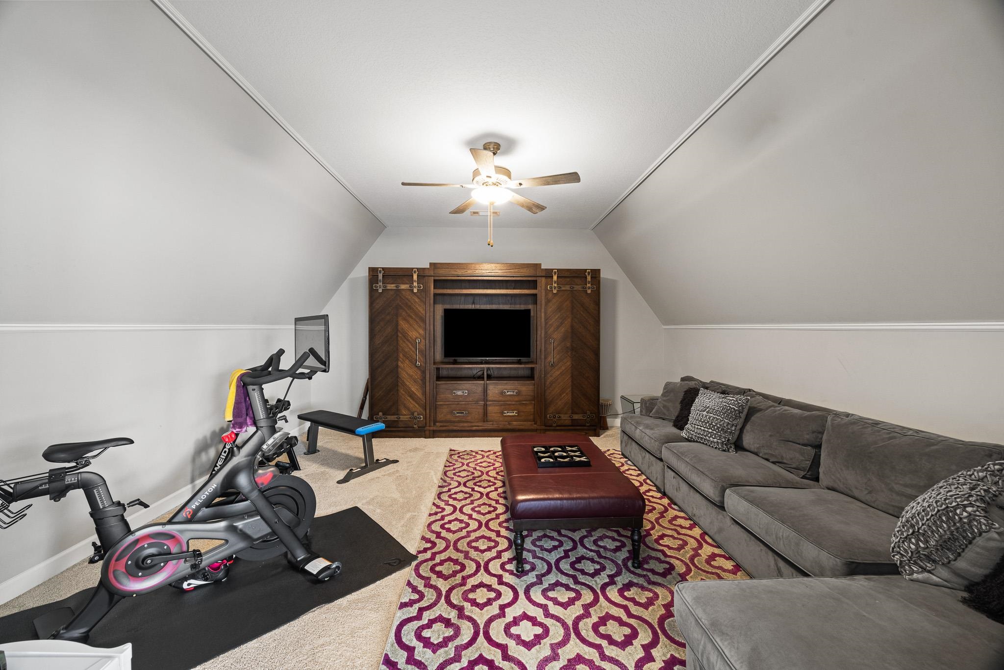4711 Carousel Lane Collierville, TN 38017 - Photo 24 of 33 a living room with furniture a rug and a chandelier