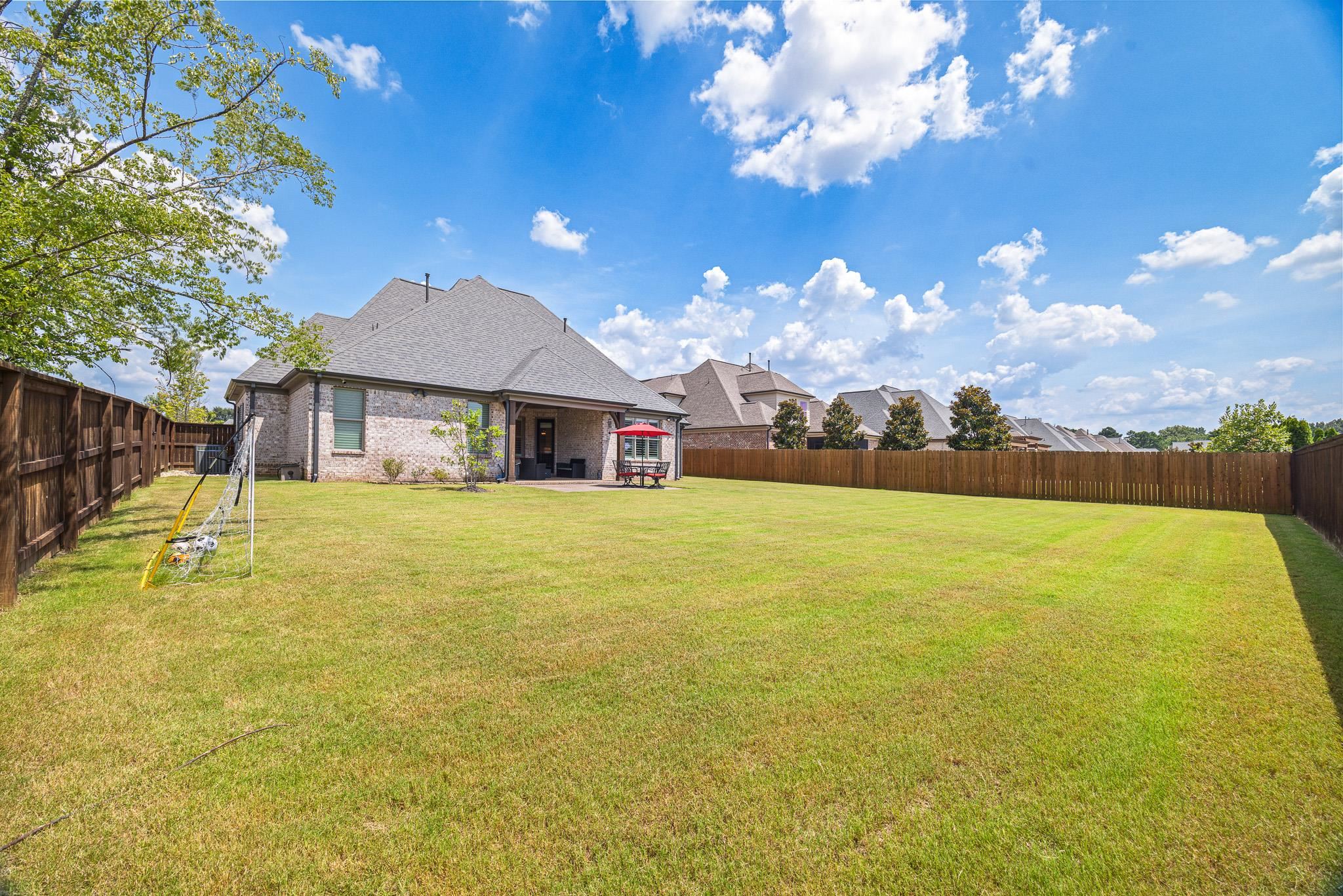 4711 Carousel Lane Collierville, TN 38017 - Photo 29 of 33 a front view of house with yard and swimming pool