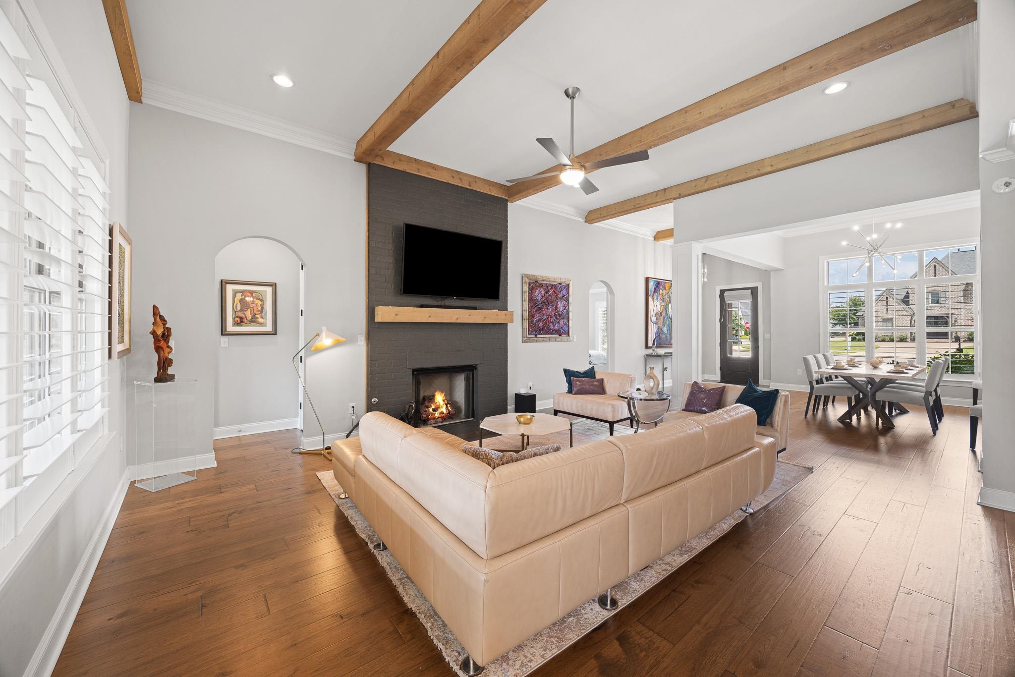 4711 Carousel Lane Collierville, TN 38017 - Photo 7 of 33 a living room with furniture a fireplace and a flat screen tv