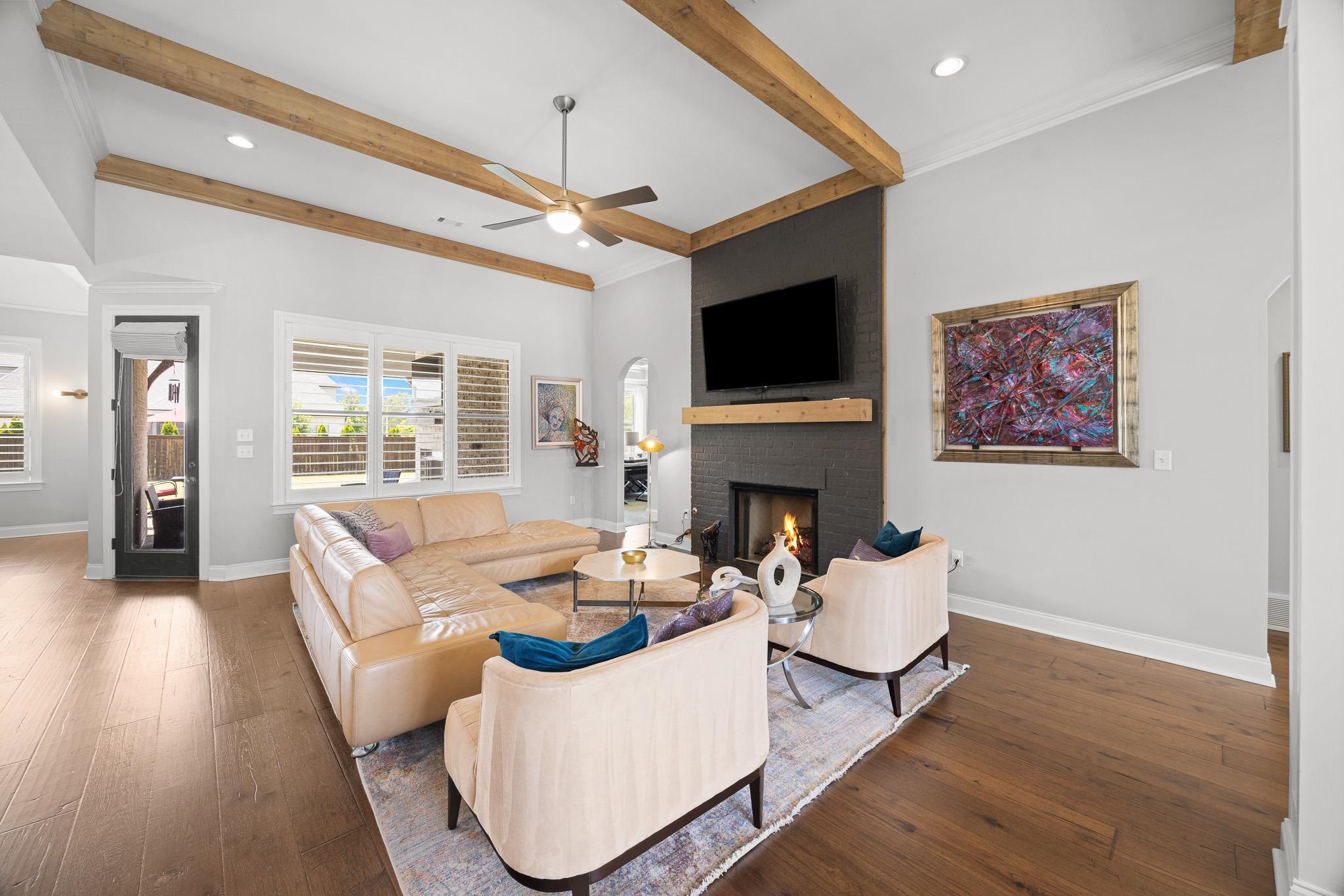 4711 Carousel Lane Collierville, TN 38017 - Photo 8 of 33 a living room with furniture a fireplace and a flat screen tv