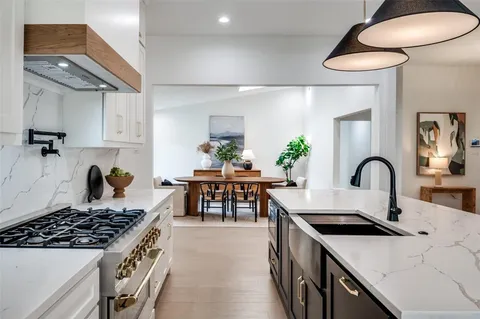 a kitchen with a table and chairs