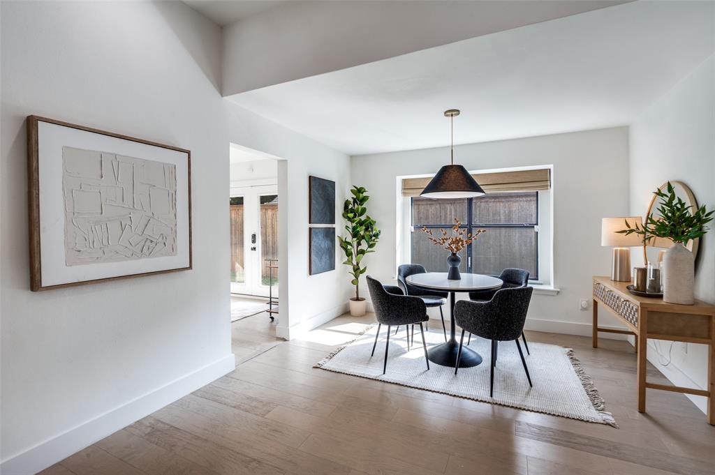 6322 Pineview Road Dallas, TX 75248 - Photo 16 of 40 a view of a dining room with furniture window and wooden floor