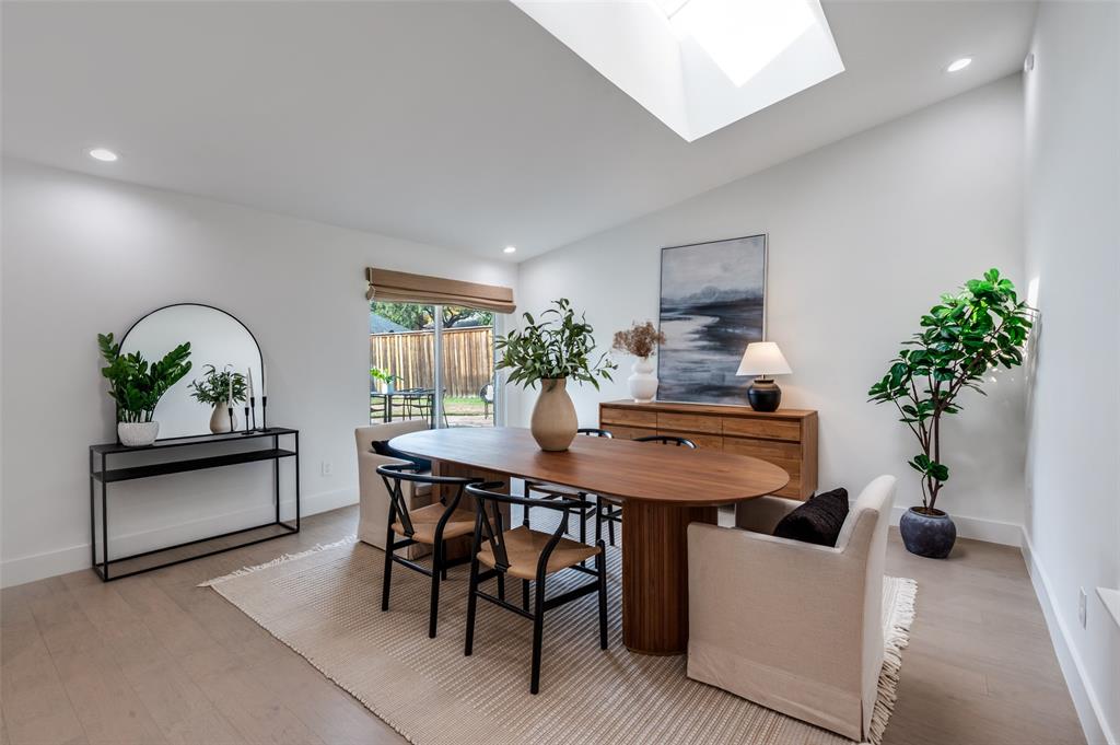 6322 Pineview Road Dallas, TX 75248 - Photo 20 of 40 a view of a dining room with furniture and a potted plant