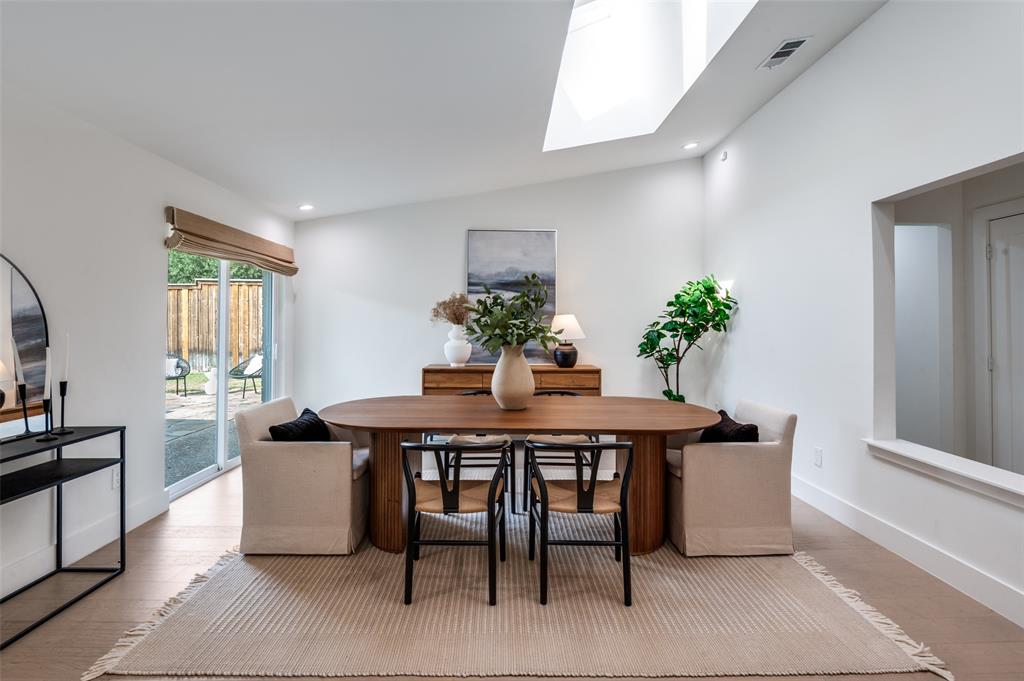 6322 Pineview Road Dallas, TX 75248 - Photo 21 of 40 a view of a dining room with furniture window and wooden floor