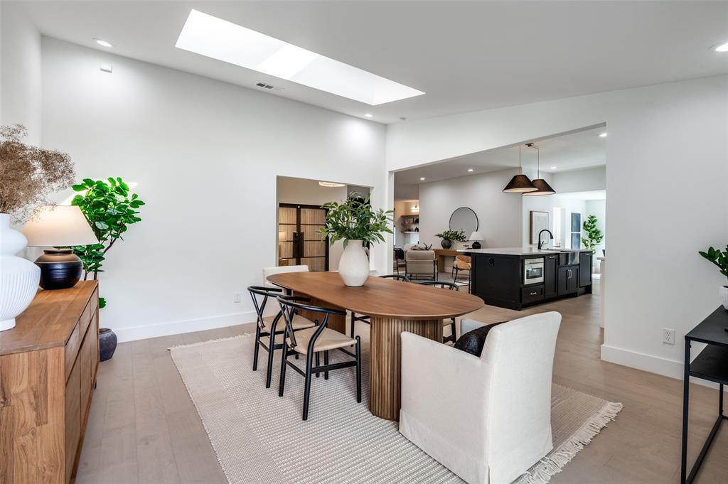 6322 Pineview Road Dallas, TX 75248 - Photo 22 of 40 a view of a dining room with furniture and wooden floor