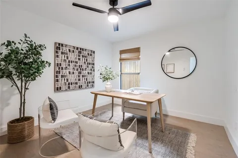 a view of a livingroom with furniture and a potted plant