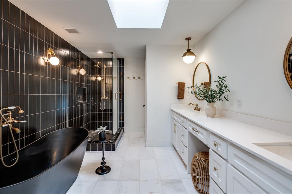 6322 Pineview Road Dallas, TX 75248 - Photo 32 of 40 a bathroom with a sink and mirror