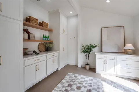 a spacious bathroom with a double vanity sink and a mirror