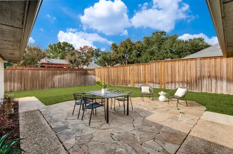a garden view with a seating space