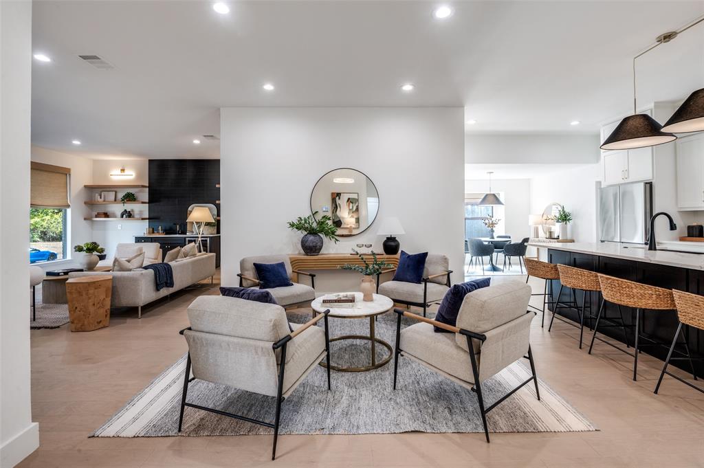 6322 Pineview Road Dallas, TX 75248 - Photo 4 of 40 a living room with fireplace furniture and a wooden floor