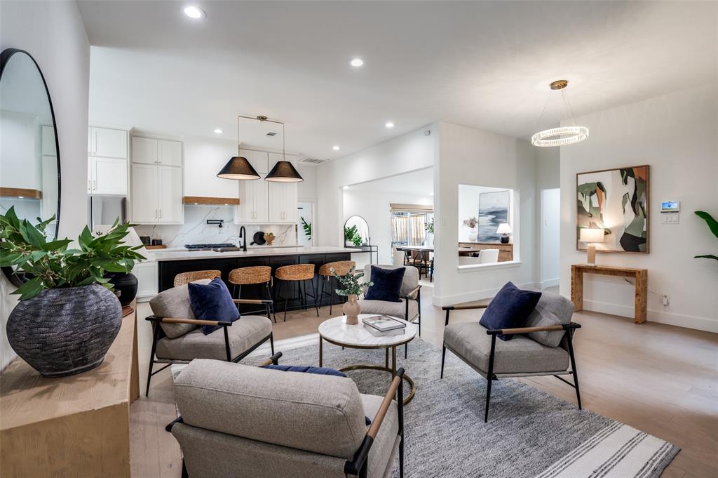 6322 Pineview Road Dallas, TX 75248 - Photo 5 of 40 a living room with furniture and a chandelier