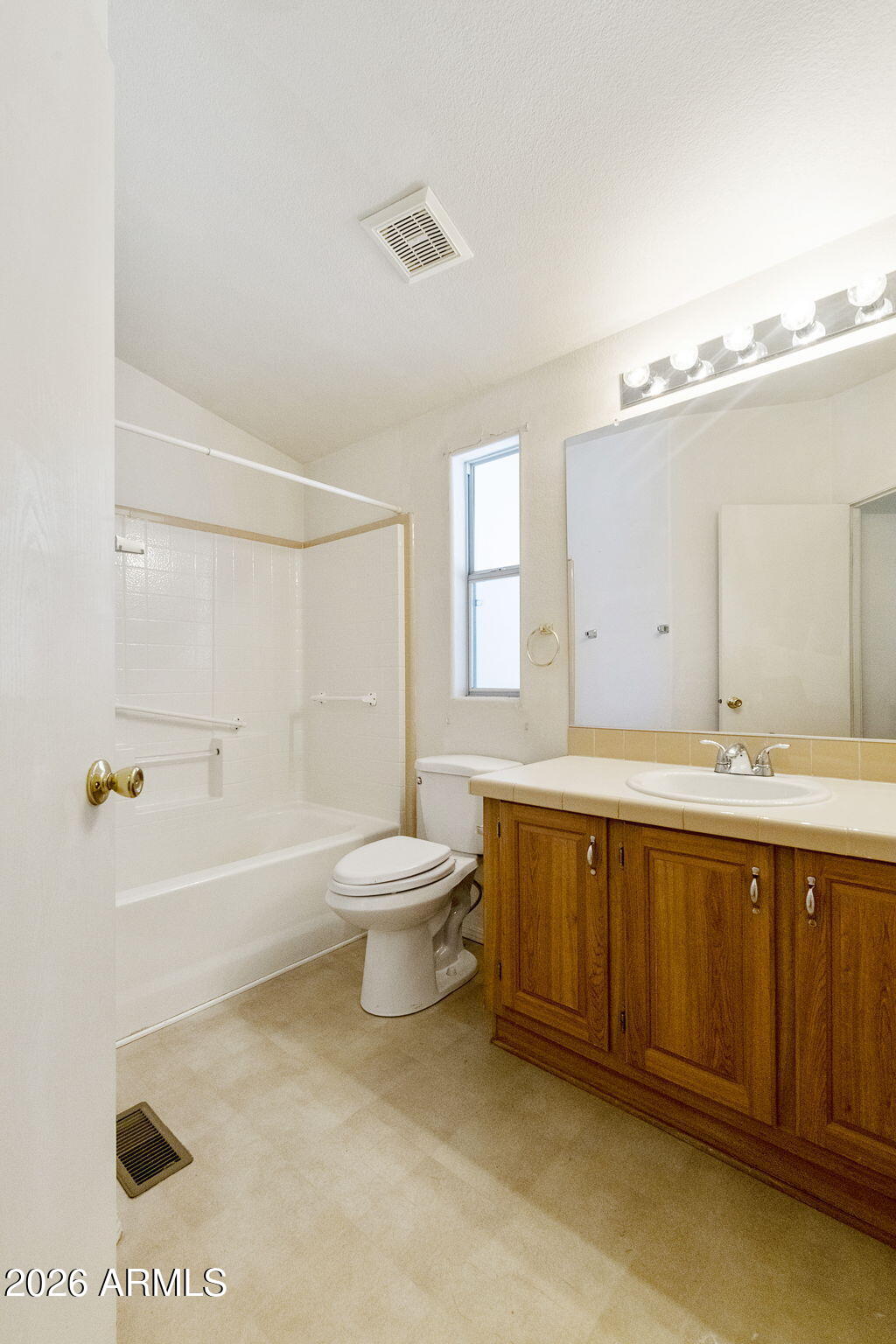 3700 South Tomahawk Road, Unit 73 Apache Junction, AZ 85119 - Photo 18 of 49 a spacious bathroom with a bathtub sink and toilet