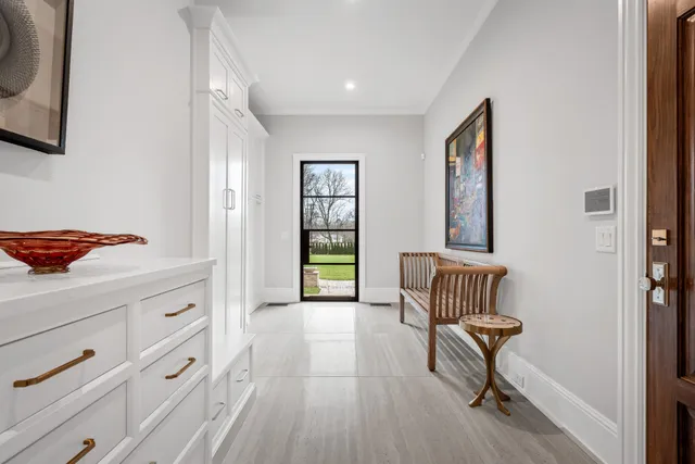 a view of walk in closet with cabinet and bedroom view