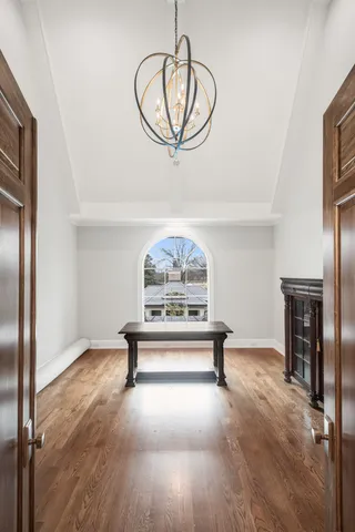 a bed room with a bed and a chair