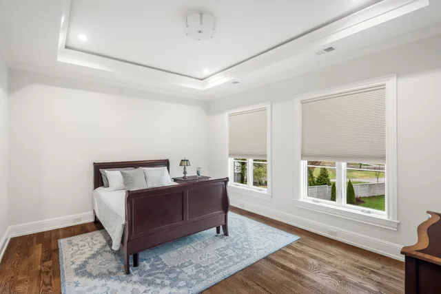 a bathroom with a shower sink and mirror