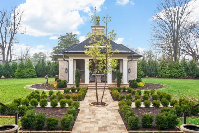 a front view of a house with garden