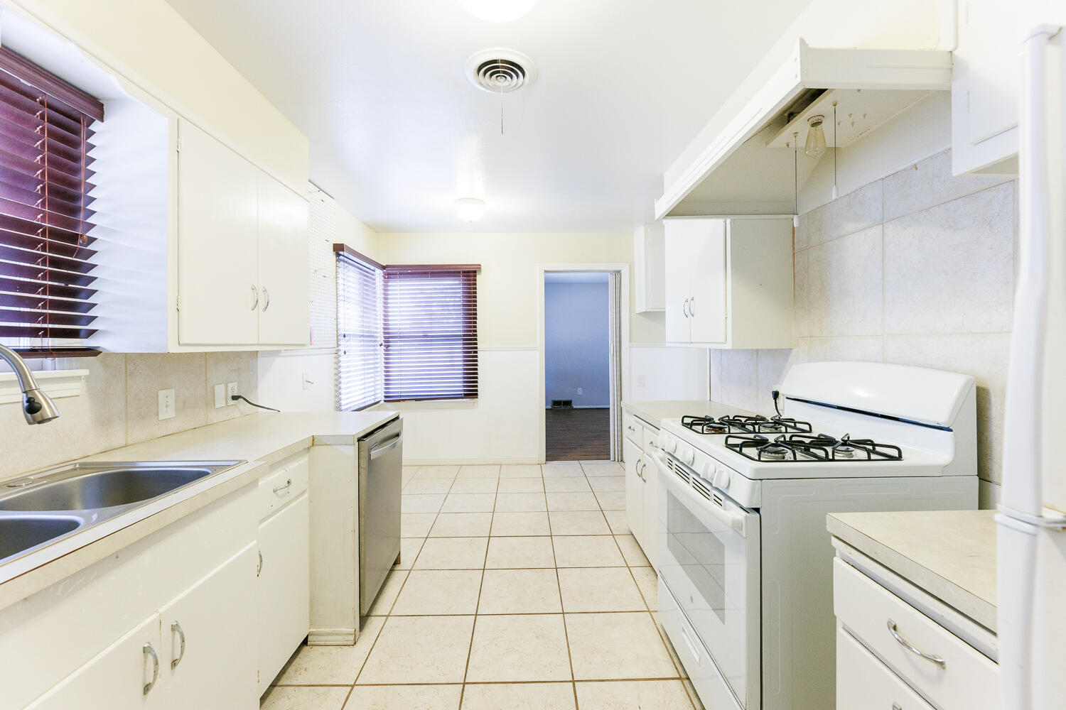 3501 26th Street Lubbock, TX 79410 - Photo 12 of 36 a kitchen with cabinets and appliances
